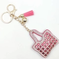 Detailed close-up of pink rhinestone handbag keychain with golden tassel and lobster clasp - Rose Red