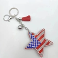 Star-shaped keychain featuring US flag pattern rhinestones and red leather tassel detail - US Flag Star Style