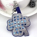 Close-up of royal blue four-leaf clover keychain with crystals, tassel, and silver bell - Royal Blue