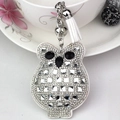 Detail of owl keychain with white rhinestones, silver bell and leather tassel on white cup - White