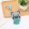 Detail eines hellblauen Panda-Schlüsselanhängers mit glitzernden Strasssteinen und Quaste - Seeblau