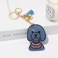 Porte-clés chien teddy en strass bleus avec chaîne dorée et pompon élégant - Bleu ciel