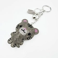Porte-clés tigre scintillant avec strass gris foncé, cloche et pompon en cuir gris - Gris