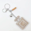 Sparkling rhinestone perfume bottle keychain with leather tassel and silver bell charm - Khaki