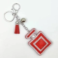 Sparkling red perfume bottle rhinestone keychain with leather tassel and silver bell charms - Red