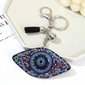 Portachiavi occhio del diavolo con strass colorati, nappina nera e campanellino d'argento - Multicolore