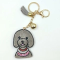 Portachiavi cane teddy con strass grigi, campanellino dorato e nappina con frange - Grigio