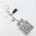 Colorful rhinestone perfume bottle keychain with black leather tassel and silver bell - Multi-color