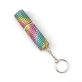 Detailed close-up of a rainbow rhinestone-encrusted portable mini perfume bottle keychain - Rainbow