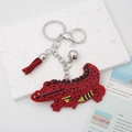 Cartoon red crocodile keychain with sparkling rhinestones, red tassel and silver bell detail - Red