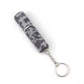 Detail view of mini 10ml perfume bottle with purple rhinestones and silver keychain ring - Black Leopard