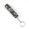 Detail view of lipstick-shaped keychain with black and yellow rhinestone crystal inlay - Sunflower