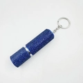 Macro detail of the dark blue rhinestone texture and silver keychain ring on a mini spray bottle - Dark Blue