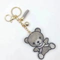 Funkelnder Strass Teddybär Schlüsselanhänger mit grauem Quast und goldener Hardware - Khaki