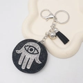 Hamsa hand keychain with black rhinestones and tassels for stylish bag decoration - Black