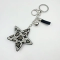 Star keychain with leopard print rhinestones, black tassel, and silver hardware - Black and White