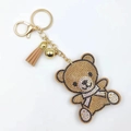 Brauner Strass Teddybär Schlüsselanhänger mit Lederquaste und goldener Glocke - Grau