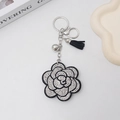 Portachiavi con fiore di cristallo e nappa in pelle nera con anello in argento elegante - Bianco
