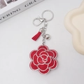 Portachiavi con fiore di pruno rosso con strass, nappa e gancio in metallo argento - Rosso