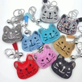 Close-up of cat head keychains with colorful rhinestones and matching tassels on white background - Other Colors Customizable
