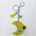 Sparkling moon and star keychain with blue evil eye charm and yellow rhinestone tassel - Yellow