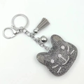 Detail of gray rhinestone bear keychain with plush tassel and silver metal hardware - Grey and Gunmetal Black