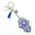 Hamsa Hand Schlüsselanhänger mit blauen Strasssteinen, Davidstern und Lederquaste - Königsblau