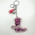 Detailed view of pink cowboy boot keychain with sparkling leopard print rhinestones and tassel - Pink