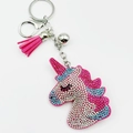 Close-up of pink unicorn keychain with glittering rhinestones and fiber tassel - Rose Red