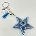 Porte-clés étoile œil protecteur avec strass bleus, pompon et clochette argent - Rose bonbon