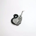 Detailed close-up of elegant swan keychain with gradient black and white rhinestones - White