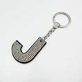 Detailed close-up of velvet alphabet J keychain with sparkling AB crystal rhinestones - Letter J