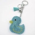 Close-up of light blue rhinestone cartoon duck keychain with silver hardware and tassel - Lake Blue