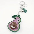 Sparkling crystal avocado keychain with pink rhinestones and a dark green tassel - Pink
