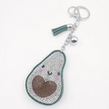 Porte-clés avocat scintillant avec strass blancs et un gland en cuir vert élégant - Sourire Blanc