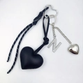 Detail of black heart PU leather keychain with rhinestone letter N and braided rope - Letter N