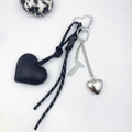 Detail of black PU leather heart pendant with rhinestone letter T and silver hardware - Letter T