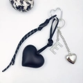 Detail of PU leather heart keychain with rhinestone letter E and woven rope accessory - Letter E