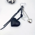 Detail of PU leather heart keychain with rhinestone letter N and braided cord on white background - Letter Z