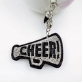 Sparkling rhinestone megaphone keychain with black tassels and white cheer lettering - Black
