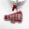 Detail of red rhinestone megaphone keychain with Cheer text and leather tassel - White with Bright Red