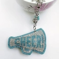 Detail of megaphone keychain with blue rhinestones, silver chain, bell and fringe charm - Lake Blue with White