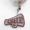 Macro detail of rhinestone CHEER megaphone keychain with purple tassel and bell charm - Purple with White