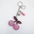 Portachiavi a ciliegia con strass rosa, nappa e campanellino argento per borse - Rosa