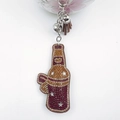 Handmade wine bottle keychain with orange rhinestones, leather tassel and silver bells - Coffee