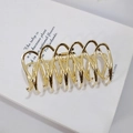 Elegante pinza para el cabello de metal dorado con diseño hueco en espiral para mujer - Oro Brillante