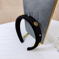 Elegant black velvet headband featuring golden camellia flowers and rhinestones - Black