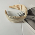 Elegant champagne satin wide headband featuring a stylish top knot and white pearl accents - Khaki