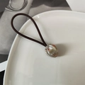 Macro shot of French style tulip hair tie with marble texture acrylic bead detail - Pink White
