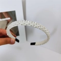Close-up of white crystal beaded headband with luxury padded fabric and soft black ear tips - White